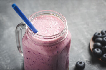 Blueberry smoothie drink in a glass jar, healthy eating concept