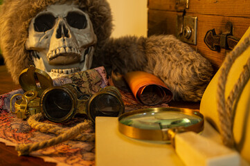 Still life with antique objects related to adventure and exploration.