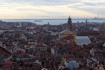 Fototapeta na wymiar Venice city view from above. Golden hour photo. Beautiful Italian architecture in details. 
