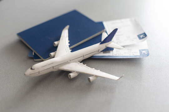Preparation for Traveling concept, toy airplane, passport with copy space