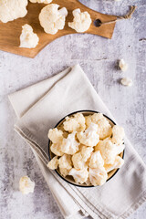 Fresh raw cauliflower in a bowl on the table. Natural antioxidant. Top and vertical view