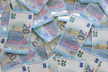 Close-up of 20 euro banknotes. Background of euro currency banknotes. Background of European paper money with 20 euro notes. A lot of money top view
