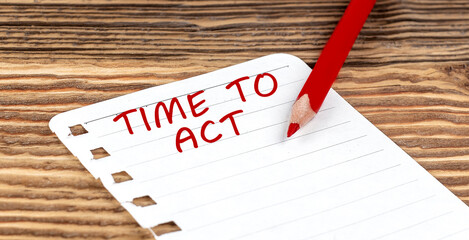 Word TIME TO ACT on a paper with ped pencil on wooden background