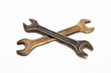 Two old metal wrenches on a white background