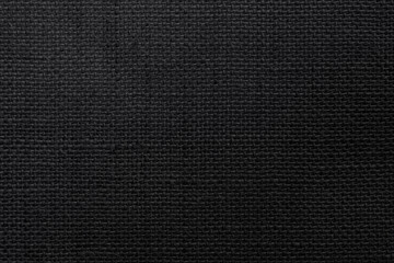 lack Hemp rope texture background. Haircloth wale black dark cloth rustic sackcloth canvas fabric texture.

