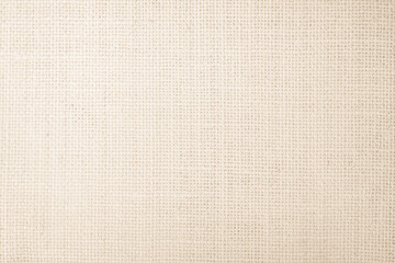 Jute hessian sackcloth burlap canvas woven texture background pattern in light beige cream color blank. Linen and cotton cloth texture as clean empty for decoration.