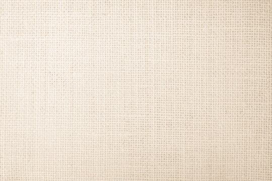 Jute hessian sackcloth burlap canvas woven texture background pattern in light beige cream color blank. Linen and cotton cloth texture as clean empty for decoration.