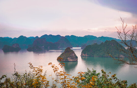 Group Of Ha Long Bay Rocky Islands On The Horizon From Above In The Sunset