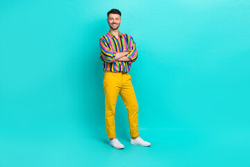 Full size photo of handsome nice satisfied guy brunet haircut wear colorful shirt standing arms crossed isolated on teal color background