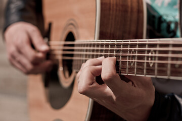 Hands playing guitar | guitarist playing acoustic guitar in closeup | singer songwriter concert...