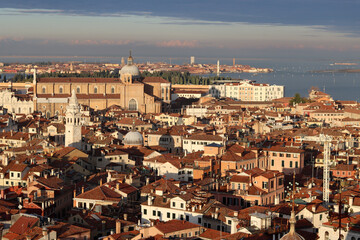 Fototapeta na wymiar Roofs of Venice city. Panoramic photo of beautiful Italian city. Popular tourist destinations concept. 