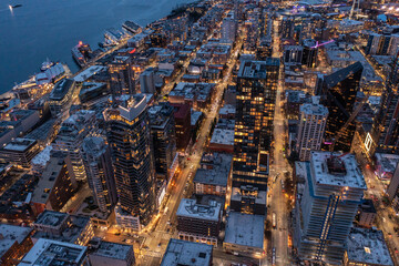 Seattle, Washington, USA -Feb. 2023, night aerial view of illuminated Seattle Downtown with...