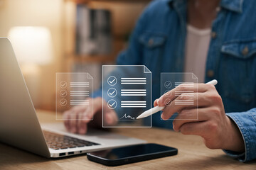 Electronic Signature Concept, Electronic Signing Businessman signs electronic documents on digital documents on virtual laptop screen using stylus pen.