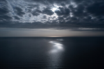 South China Sea Morning aerial view with dramatic clouds, sunlight and reflection. Photo from Ho Tram in Vietnam.