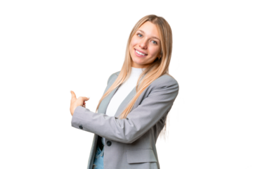 Young pretty blonde woman over isolated chroma key background pointing back