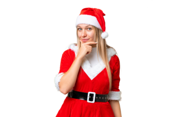 Young blonde woman with christmas hat over isolated chroma key background thinking