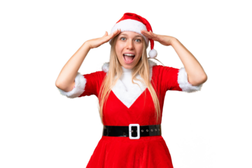 Young blonde woman with christmas hat over isolated chroma key background with surprise expression