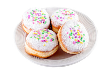 Isolated carnival sprinkled doughnuts  on white plate, top view