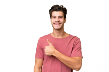 Young handsome caucasian man over isolated background giving a thumbs up gesture