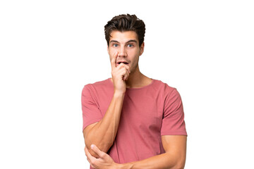Fototapeta na wymiar Young handsome caucasian man over isolated background surprised and shocked while looking right