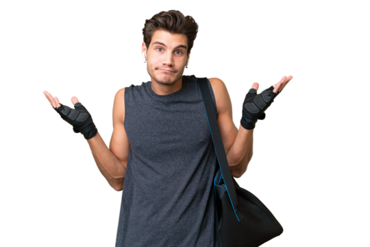 Young sport caucasian man with sport bag over over isolated background having doubts while raising hands