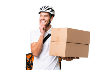 Delivery man wearing a helmet bike over isolated background thinking an idea while looking up