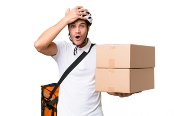 Delivery man wearing a helmet bike over isolated background with surprise expression