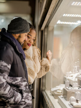 Young couple window shopping for jewelry