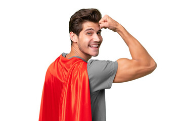Young handsome caucasian man over isolated background in superhero costume and doing strong gesture