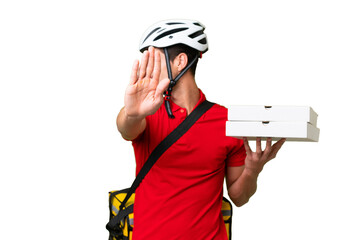 Pizza delivery man with work uniform picking up pizza boxes over isolated background making stop...