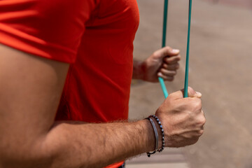 Close-up of man in sports clothing exercising in city