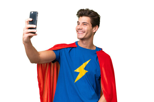 Super Hero caucasian man over isolated background making a selfie