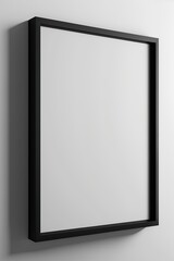 Front view Vertical black frame blank, close up on white wall