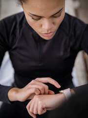 Athlete woman checking smart watch