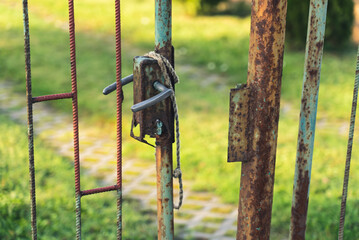 Open door leading to the backyard. Rusty, dirty, abandoned gate door, ready for waste. High quality photo