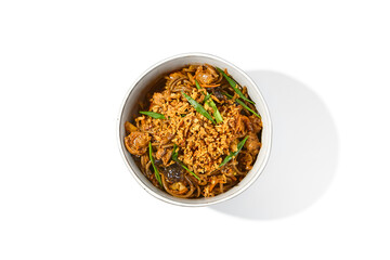 Asian fried buckwheat noodles with chicken and vegetables isolated on white background Japanese fried noodles in teriyaki sauce in ceramic bowl. Stir-fry soba with chicken in minimal style. Wok menu