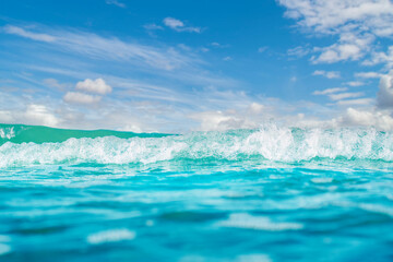Panorama of a calm sea with clouds on the horizon. Background on the theme of summer vacation and ecology. Crystal clear ocean water.