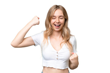 Young English woman over isolated background celebrating a victory