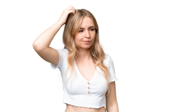Young English woman over isolated background having doubts while scratching head