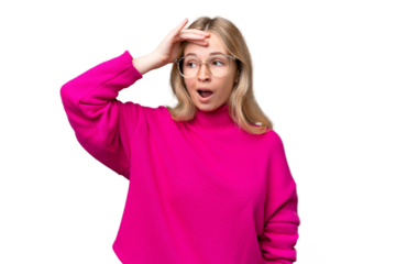 Young English woman over isolated background doing surprise gesture while looking to the side