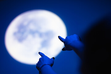 Enjoying night sky and full Moon outdoors.