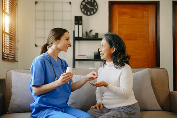 medical doctor holing patient's hands and comforting her.Kind doctor giving real support for patient.