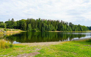 Landscape at the Unterer Haus-Herzberger Teich. Nature at the lake near Clausthal-Zellerfeld in the Harz National Park. Former mining pond.
