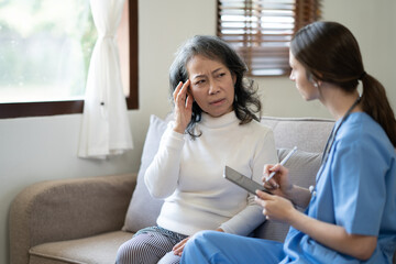 Professional Doctor and patient are discussing at clinic, Happy young female doctor provide medical care.   .