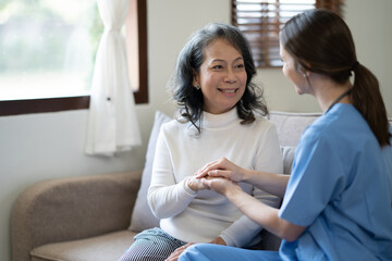 Female doctor holding female patient hands with compassion and comfort for encouragement and...