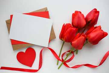 greeting card happy valentine's day. bouquet of tulips and red heart