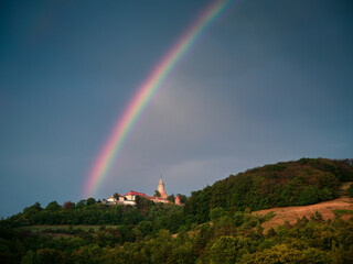 Leuchtenburg castle with a rainbow and a dramatic dark sky, Seitenroda, Germany.