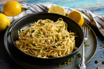 Spaghetti with lemon Parmesan cream sauce and pine nuts
