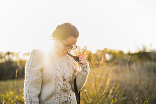 Cheerful woman enjoying time in countryside