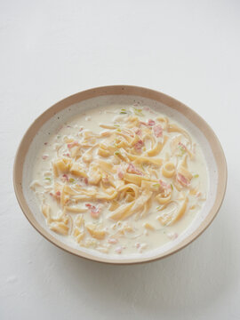 cream soup with pasta bowl. top view